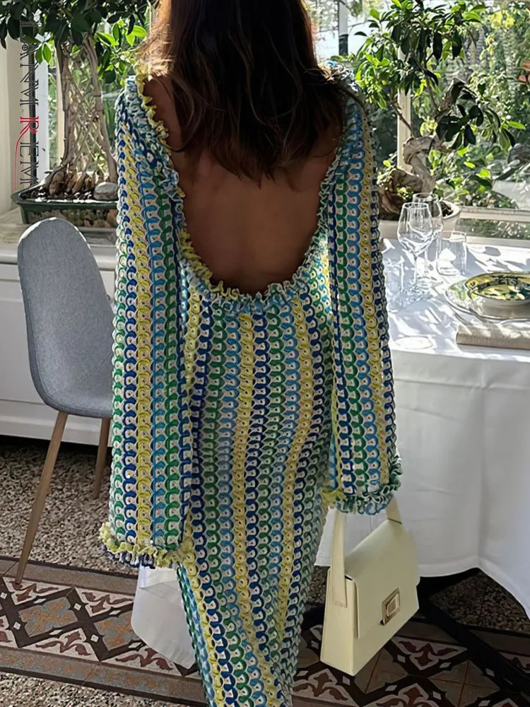 Robe en dentelle dos nu manche longue